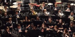 Pictured in performance is the USA Wind Ensemble.